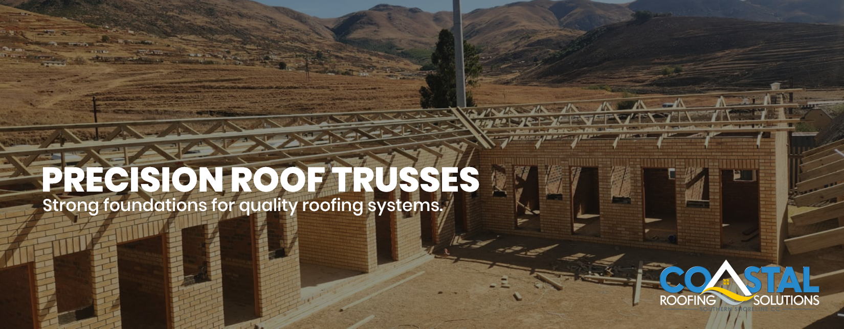 Timber roof trusses installed on a new commercial brick building by Coastal Roofing Solutions in Port Edward, KwaZulu-Natal.